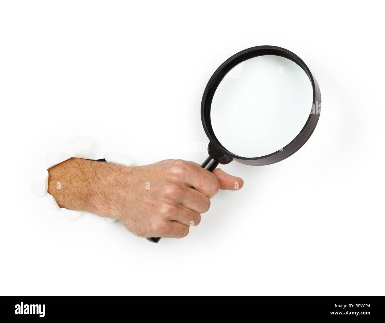 Male hand holding a magnifying glass on a white background Stock Photo