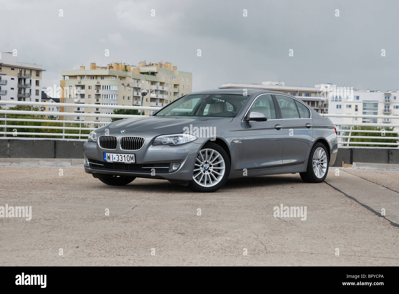 BMW 535i - MY 2010 - grey metallic - four doors (4D) - German premium higher class sedan, segment E (executive) - city Stock Photo