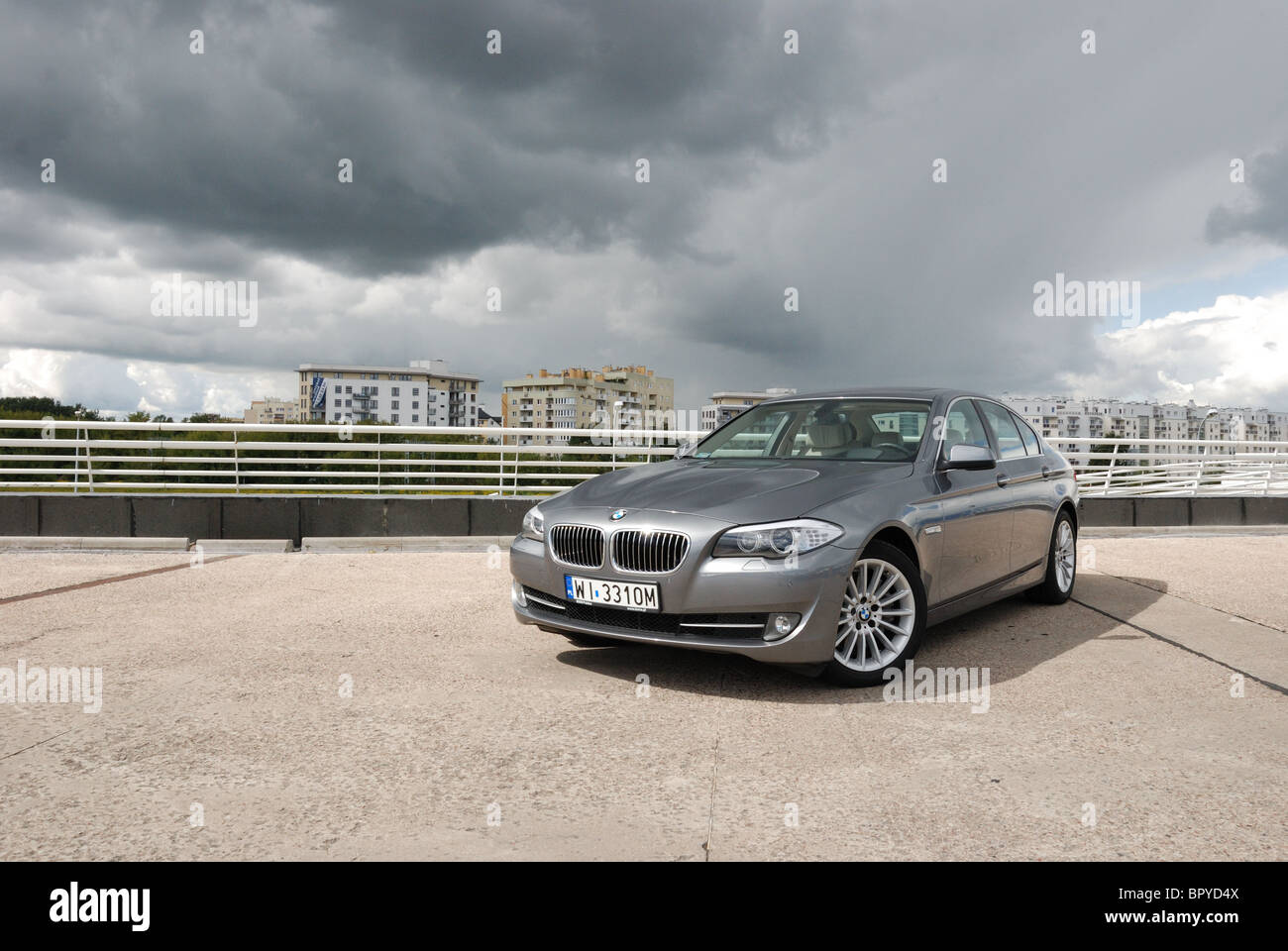 BMW 535i - MY 2010 - grey metallic - four doors (4D) - German premium higher class sedan, segment E (executive) - city Stock Photo