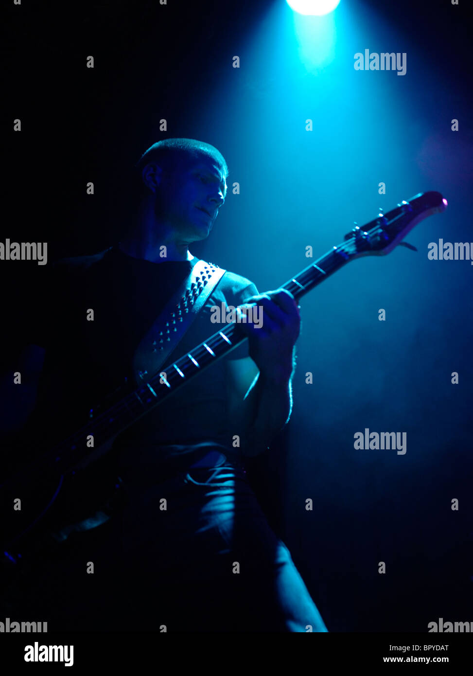 Bass guitarist in the spotlight Stock Photo Alamy