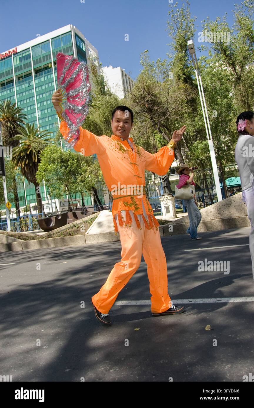 Chinese man with a hand fan Stock Photo - Alamy