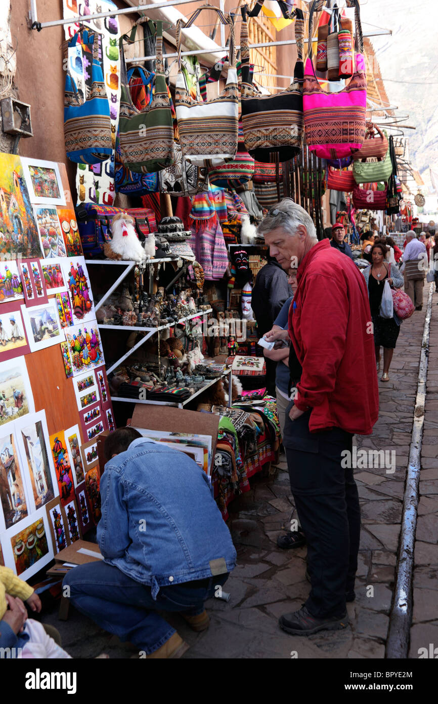 Tourist shopping at Pisac market , Sacred Valley , near Cusco, Peru Stock Photo