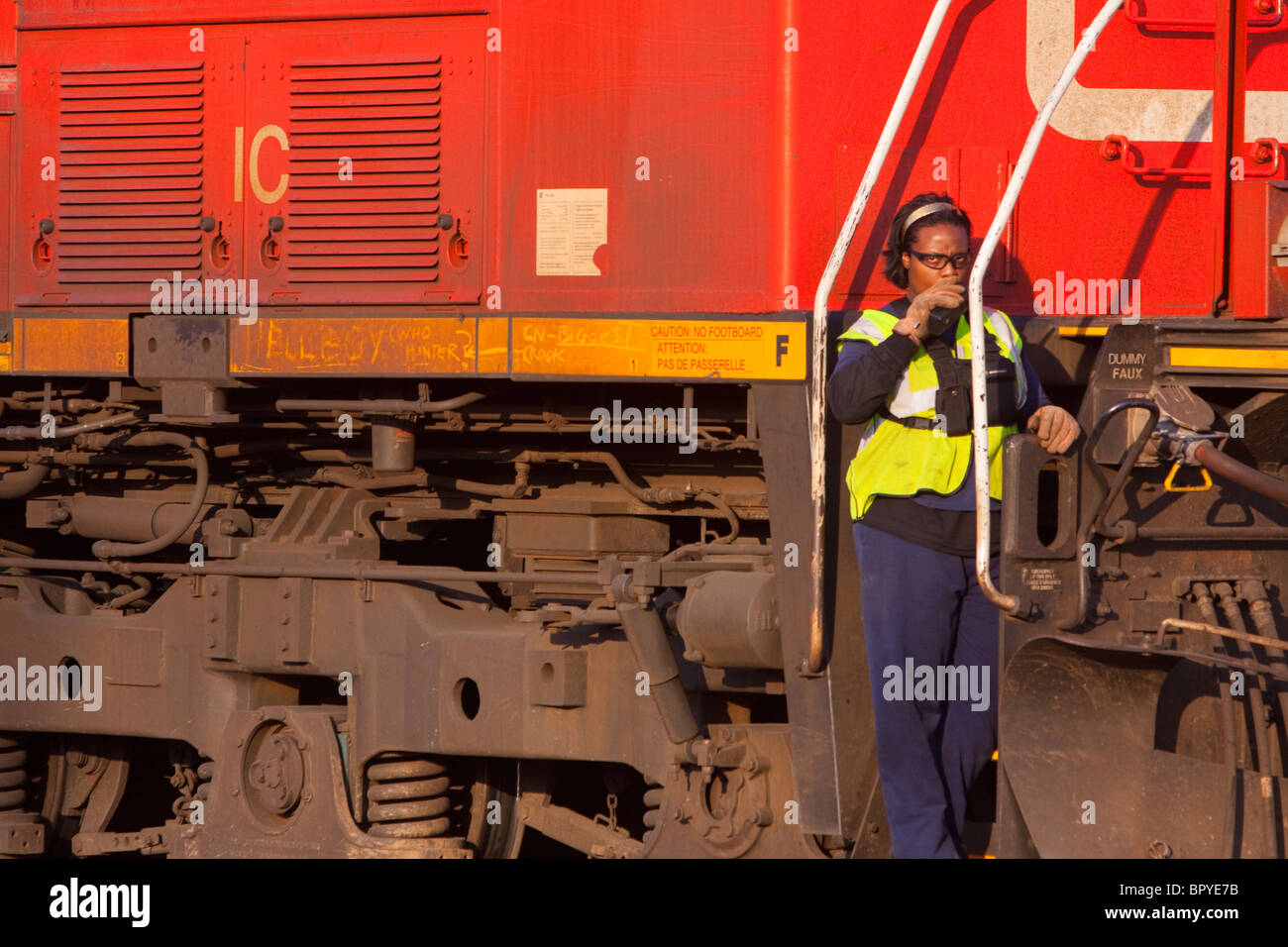 A Canadian National freight conductor guides her locomotives in the yard in Homewood, IL. Stock Photo