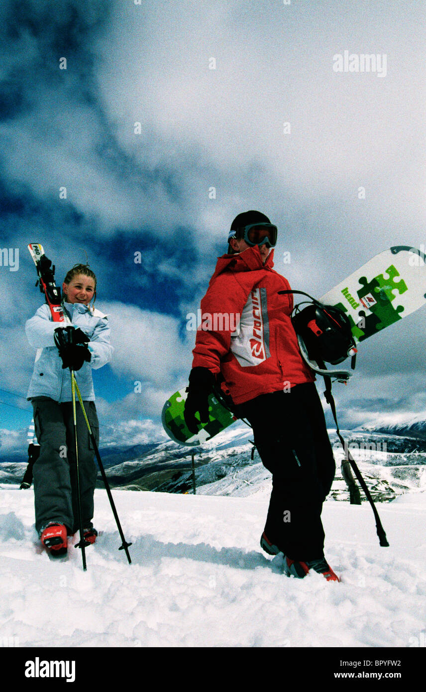 Kids with skis and snowboard. Stock Photo