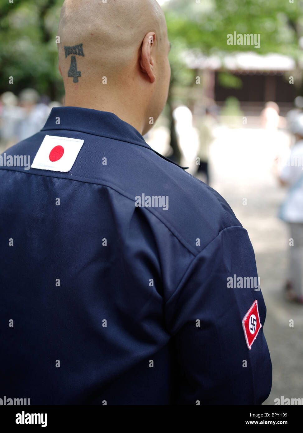 Extreme Far right nationalists at Yasukuni Shrine on August 15 anniversary. Japanese flag and Nazi Swastika on uniform. Stock Photo