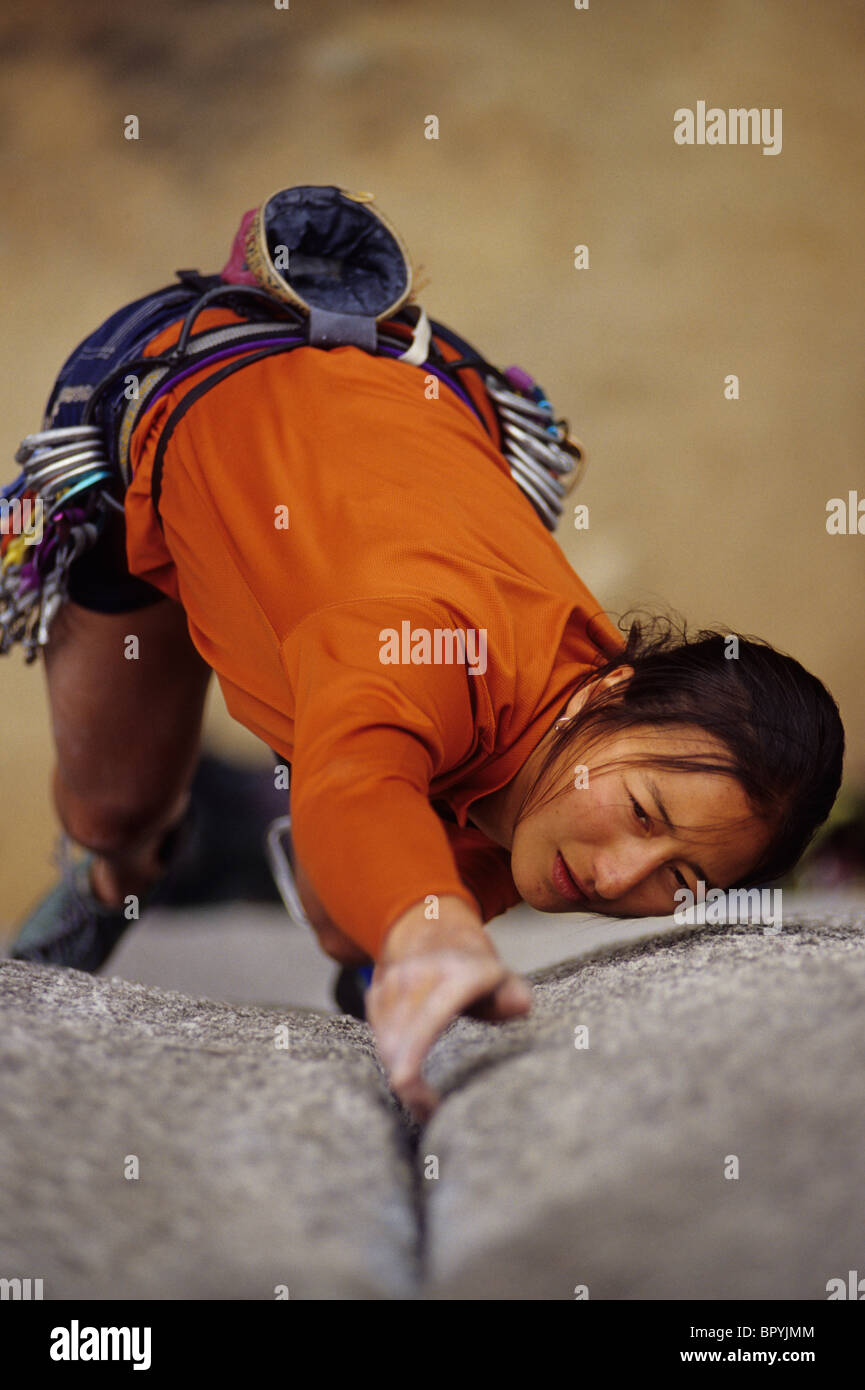 Woman rock climbing at the Smoke Bluffs, Squamish, British Columbia
