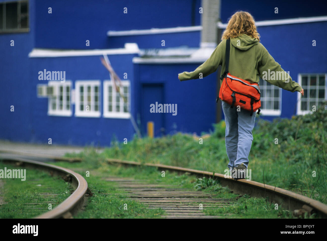 Woman balancing on train track, Vancouver, British Columbia Stock Photo ...
