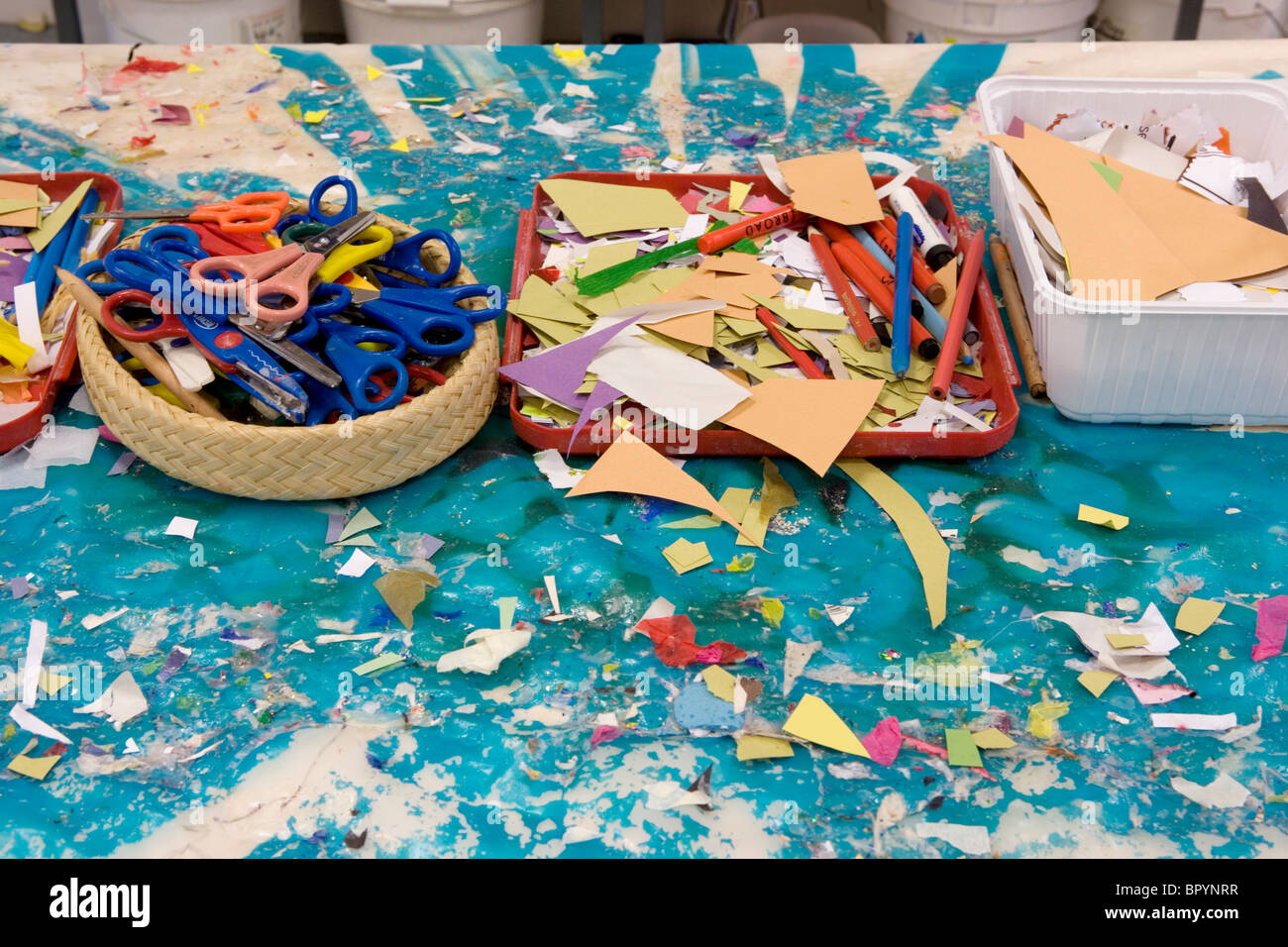 A nursery school classroom table art materials on it. Stock Photo