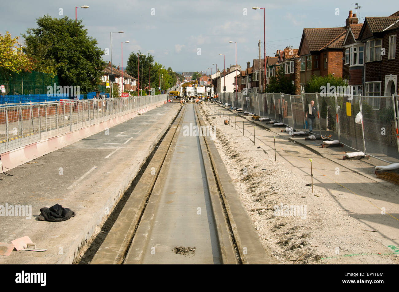 Metrolink on-street light rail (tram) system under construction on Manchester Road, Droylsden, Tameside, Manchester, England, UK Stock Photo