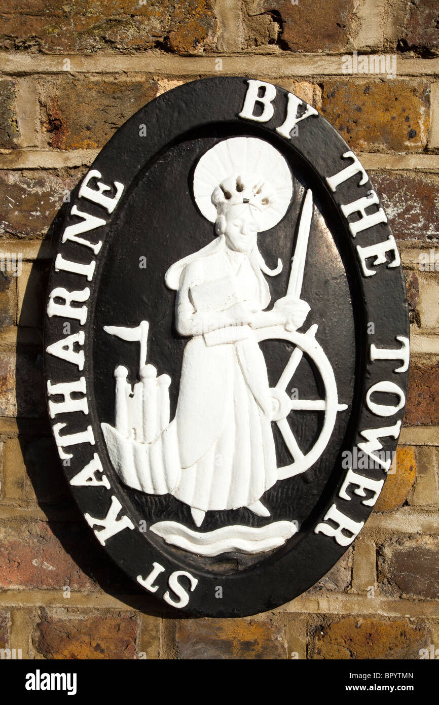 England, Greater London, London Borough of Tower Hamlets. St Katharine by the Tower plaque near entrance to St Katharine Docks Stock Photo
