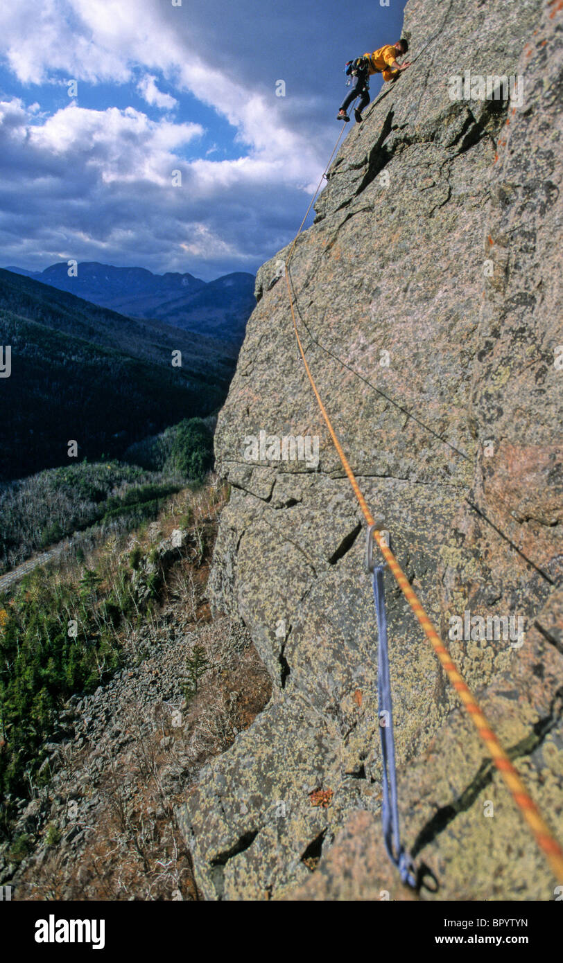 A man rock climbs on lead in Adirondack State Park near Lake Placid, NY