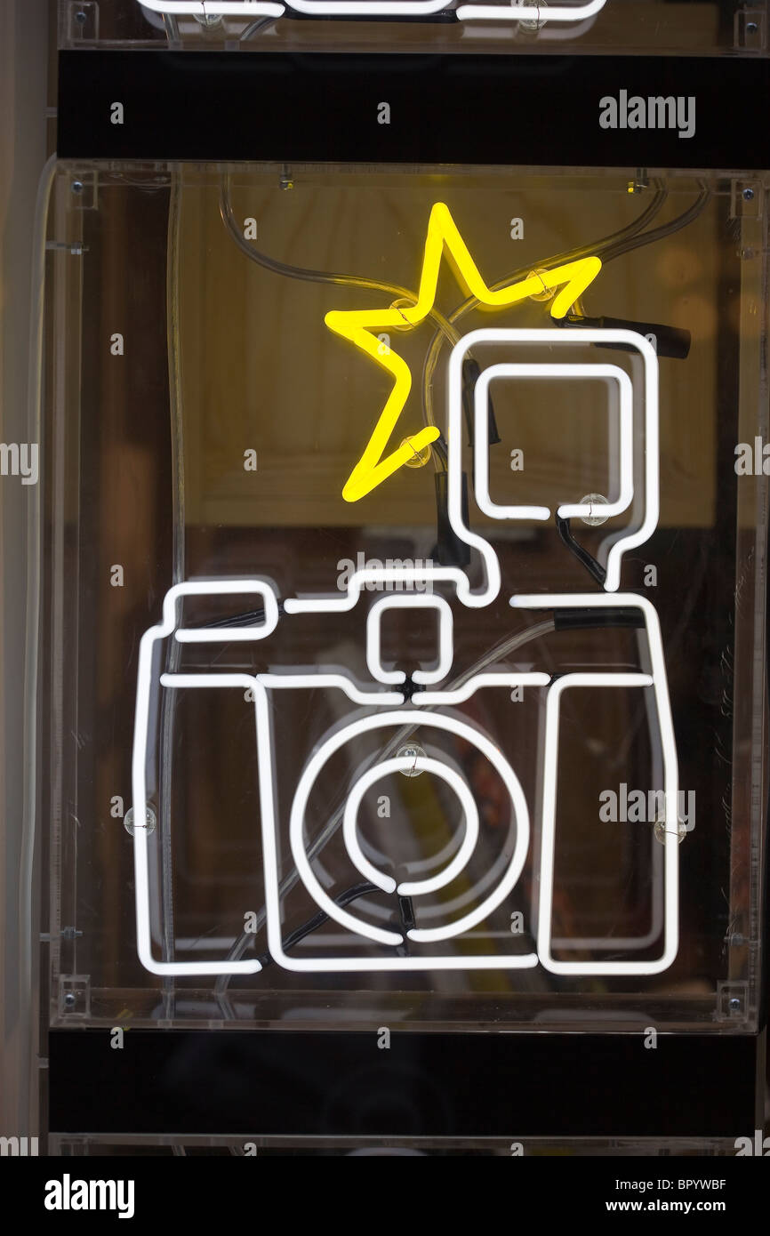 Neon Light Camera in Shop Window Stock Photo - Alamy