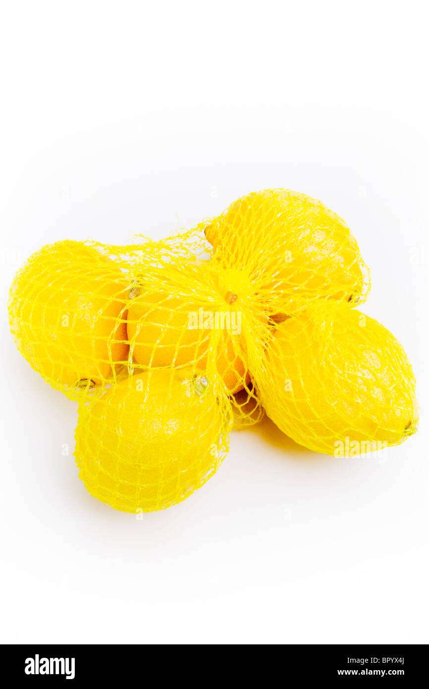 Net bag with supermarket lemons Stock Photo