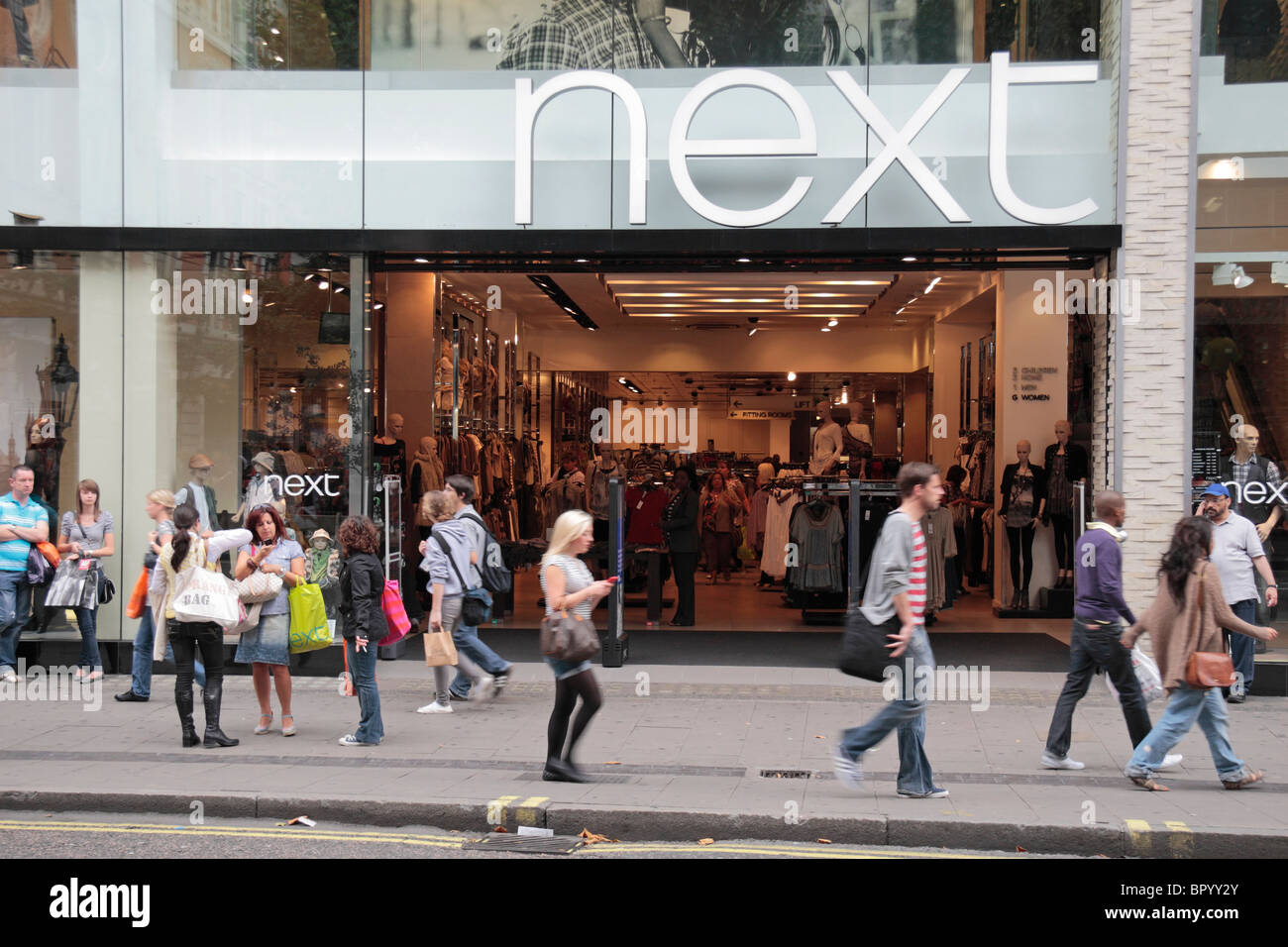 Street view of the NEXT clothing and fashion store on Oxford Street, London, UK. Stock Photo