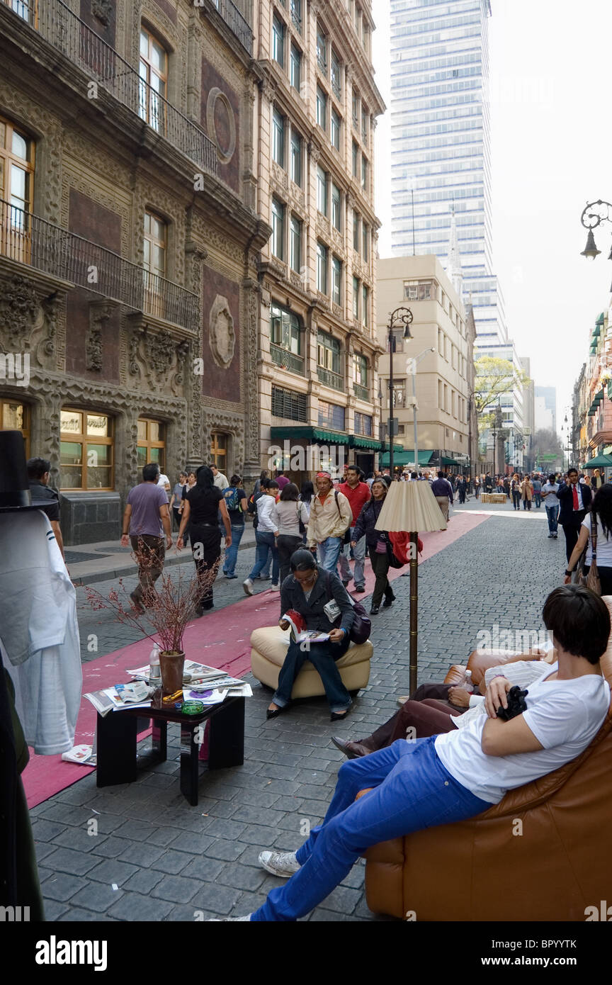 Persons sitting in a room in the middle of the street in Mexico city Stock Photo