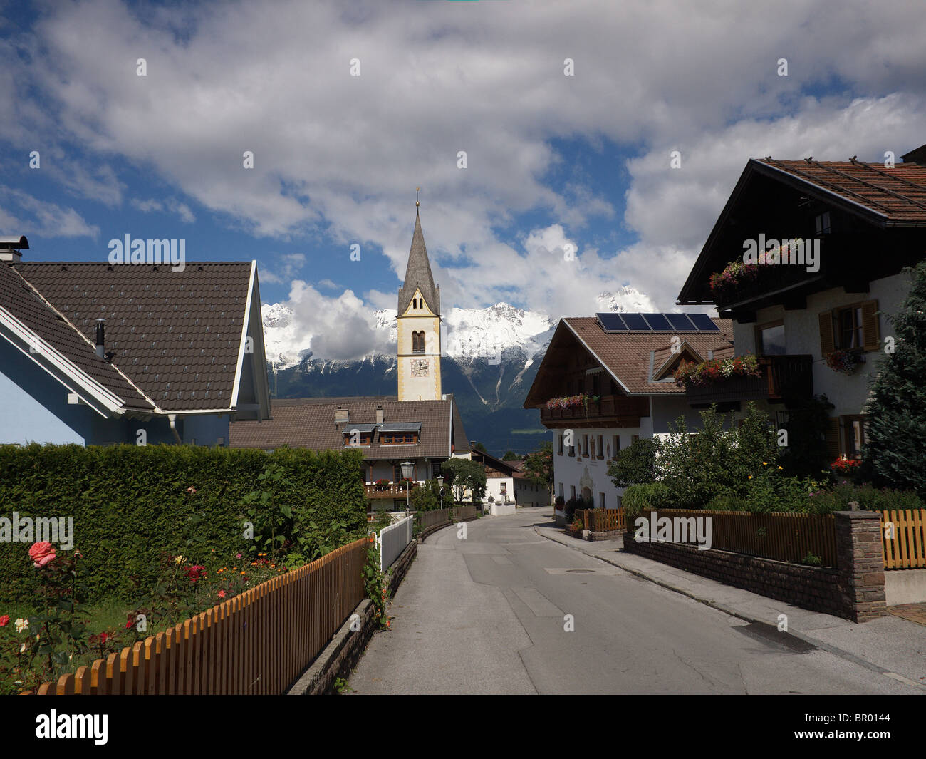 Village street with church in Sistrans, Innsbruck Tirol Austria Stock Photo