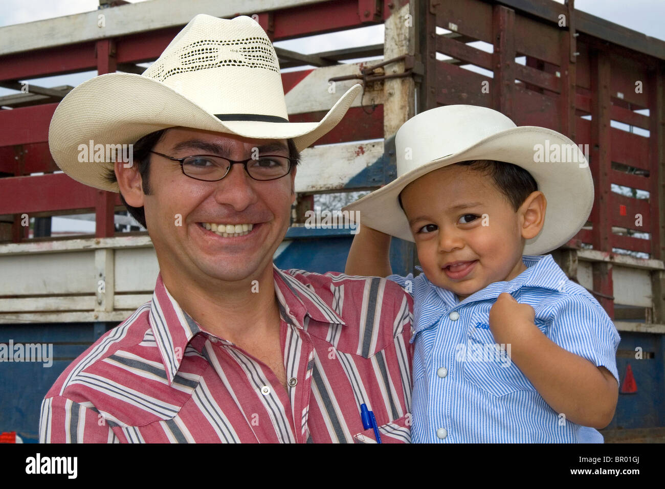 Costa Rican rancher and his son at Liberia, Costa Rica. MR Stock Photo