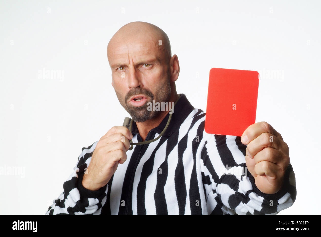 A soccer referee showing a red card Stock Photo