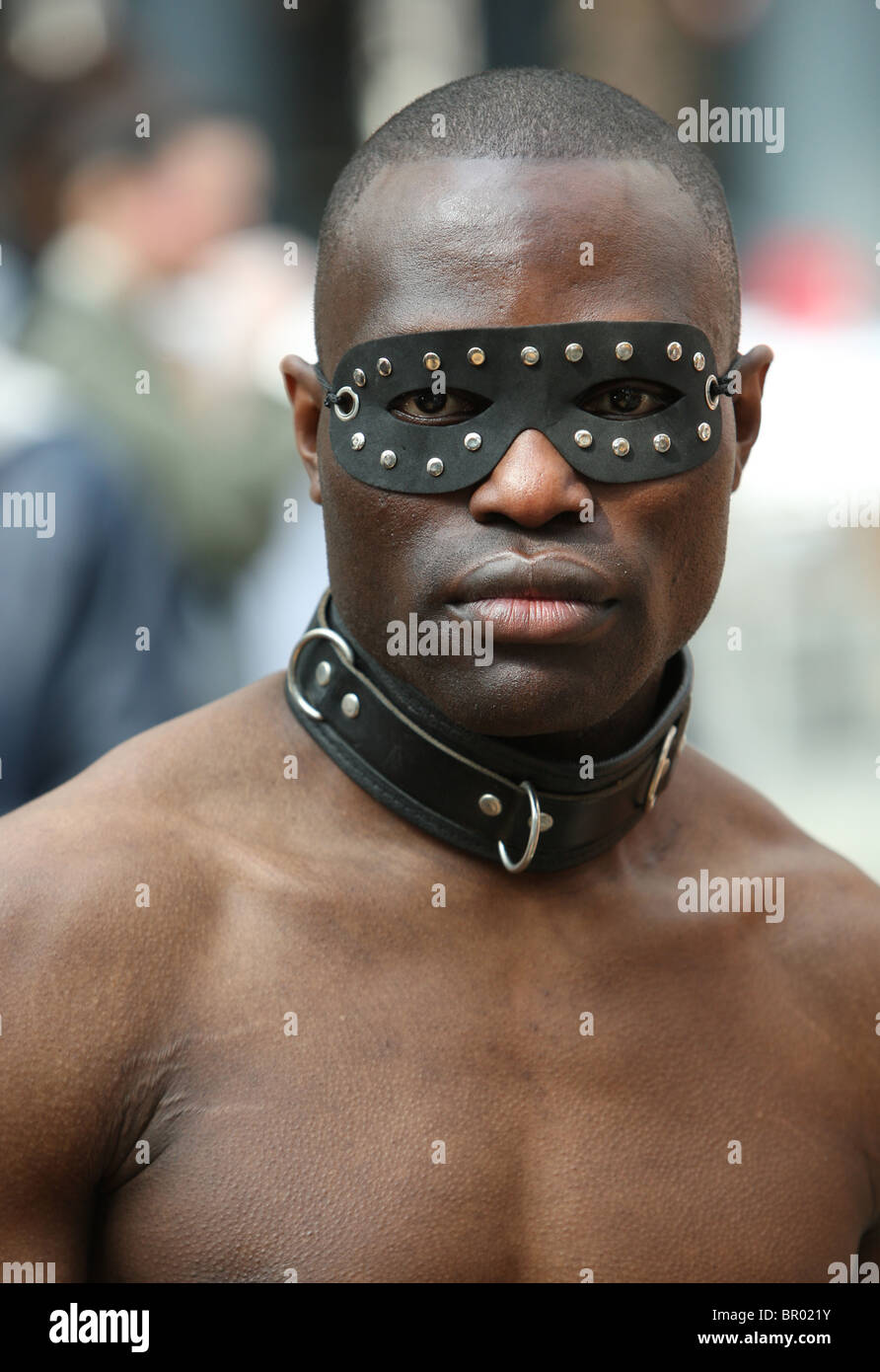 Portrait of black guy wearing a mask, working as model during the Alterative Fashion Week 2010
