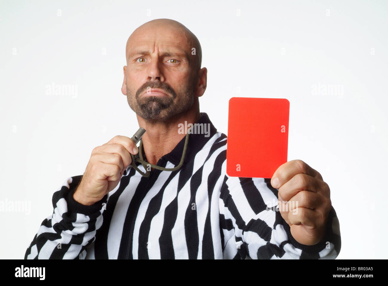 A soccer referee showing a red card Stock Photo