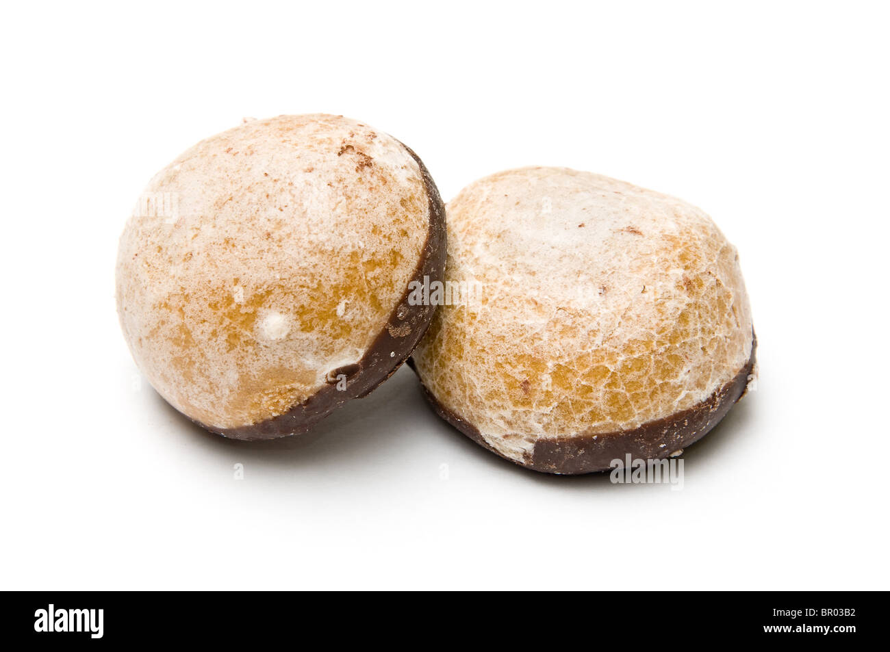 Two honey biscuits piled with chocolate cover isolated on white Stock