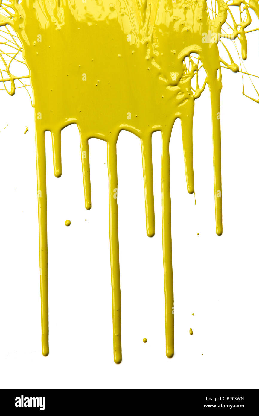 Yellow paint dripping isolated over white background Stock Photo
