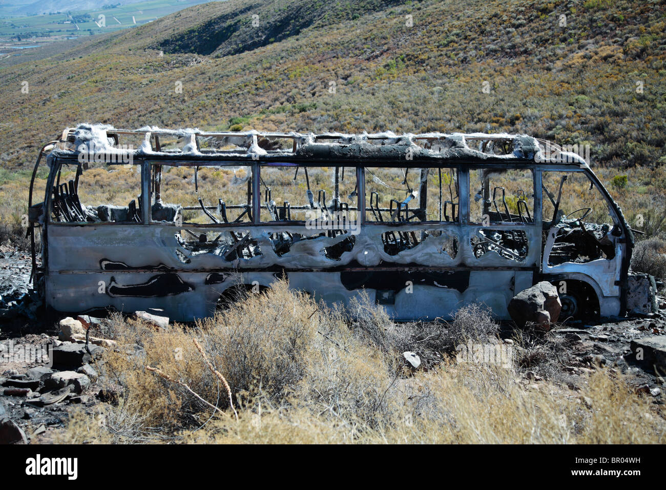 Burnt out bus Stock Photo