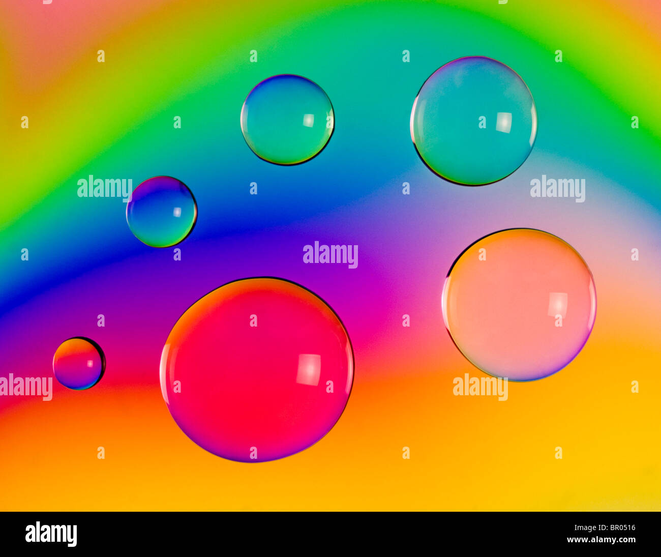 Abstract image of drops of water coloured by cross polarisation. Stock Photo