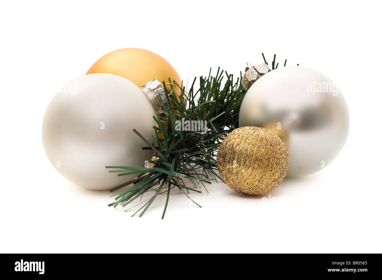 Four christmas spheres and a pine branch isolated on white Stock Photo