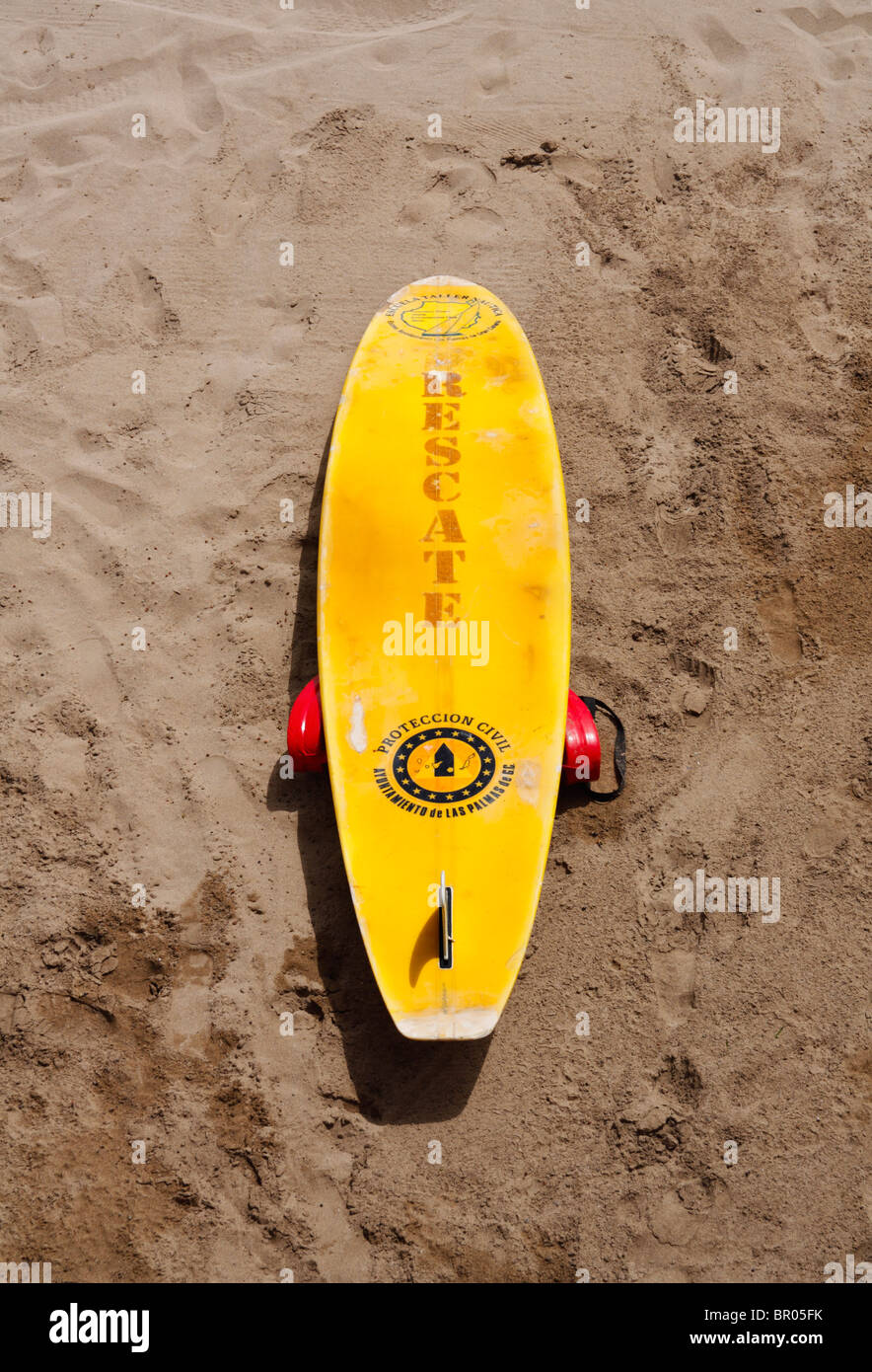 Lifeguard's surfboard on beach in Spain, Rescate is rescue in Spanish