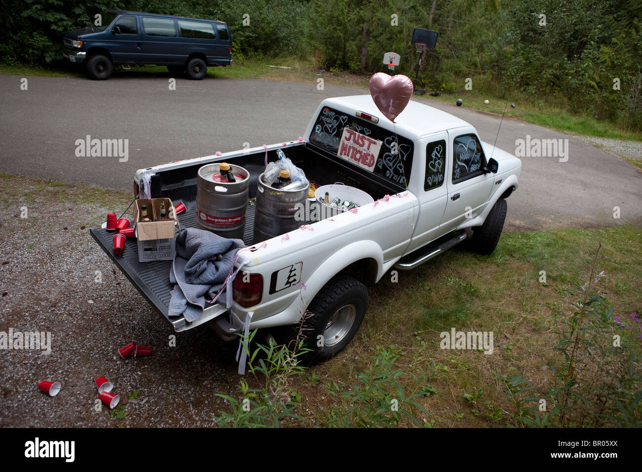 white trash just marries truck with empty keg Stock Photo