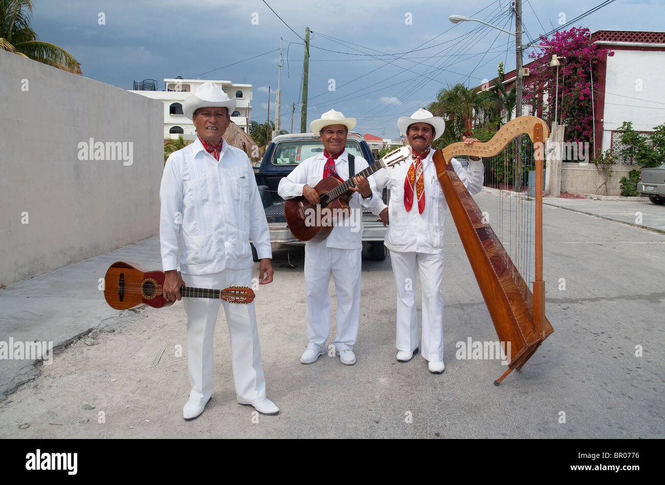 Trio of Mexican musicians photographed on a street of Puerto Morelos