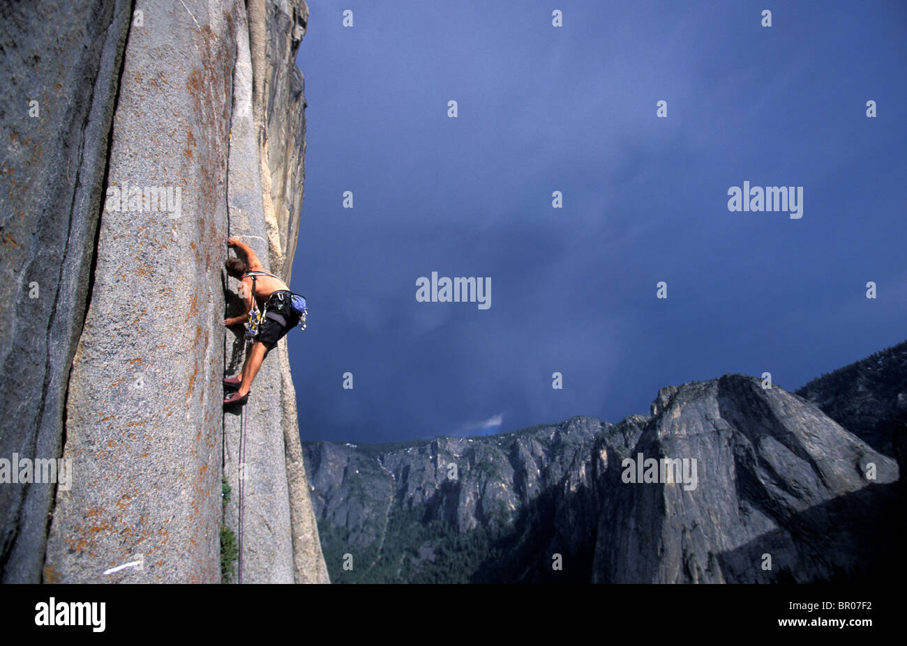 A male rock climber lead climbing a granite big wall in Yosemite