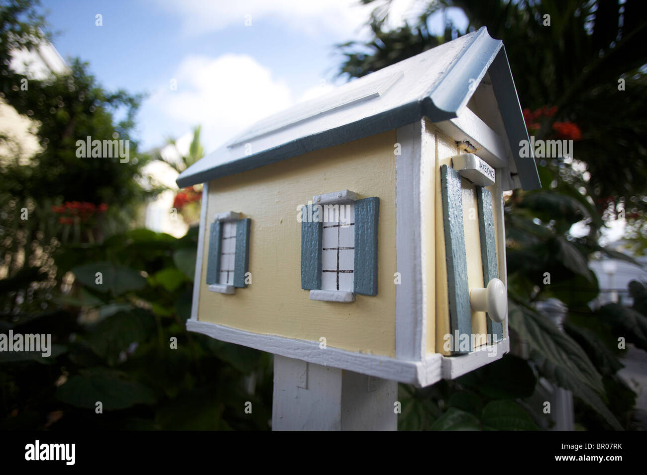 A quaint, unique wooden mailbox made to look like a house Stock Photo