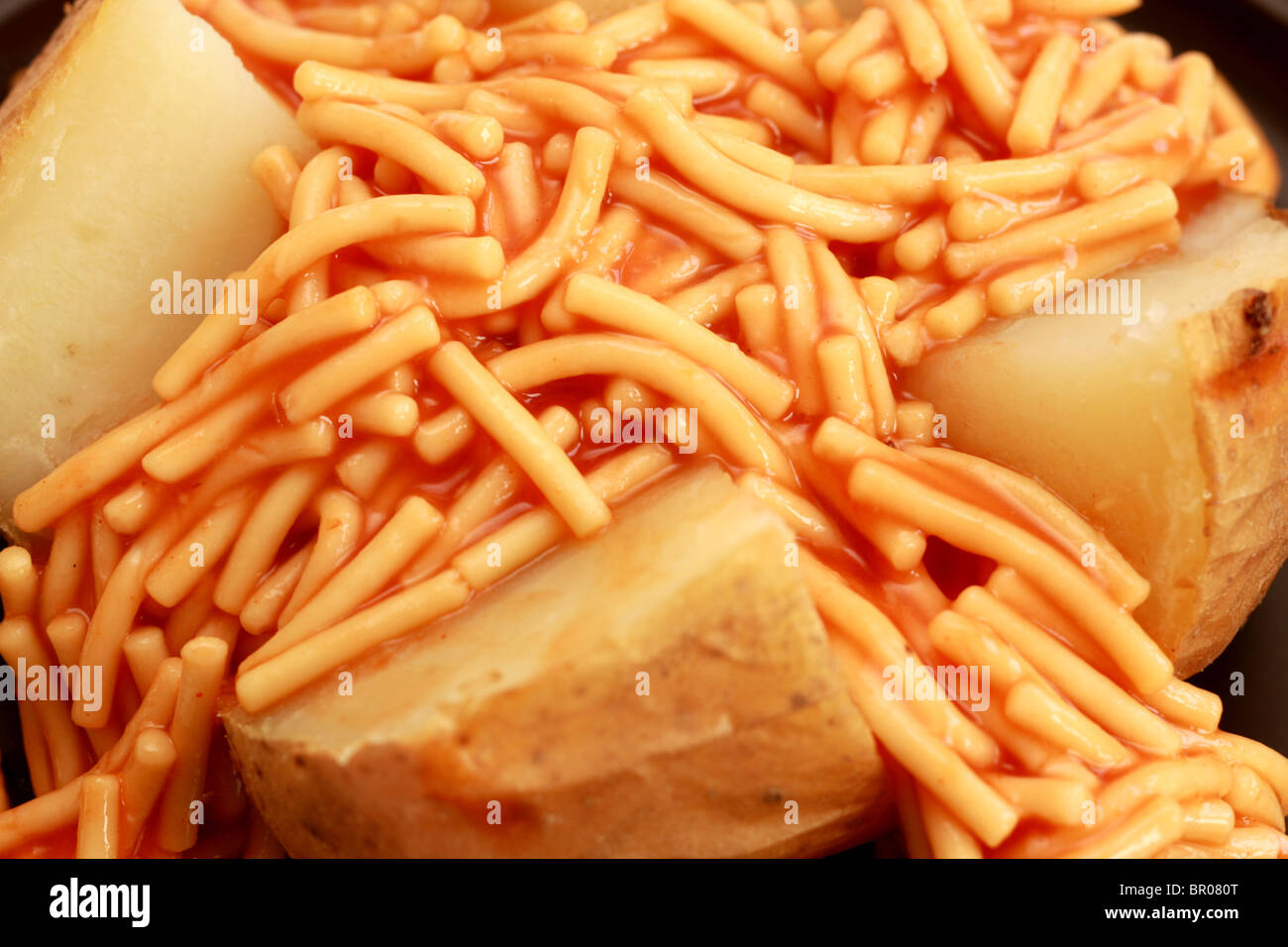 Jacket Potato with Spaghetti Stock Photo Alamy