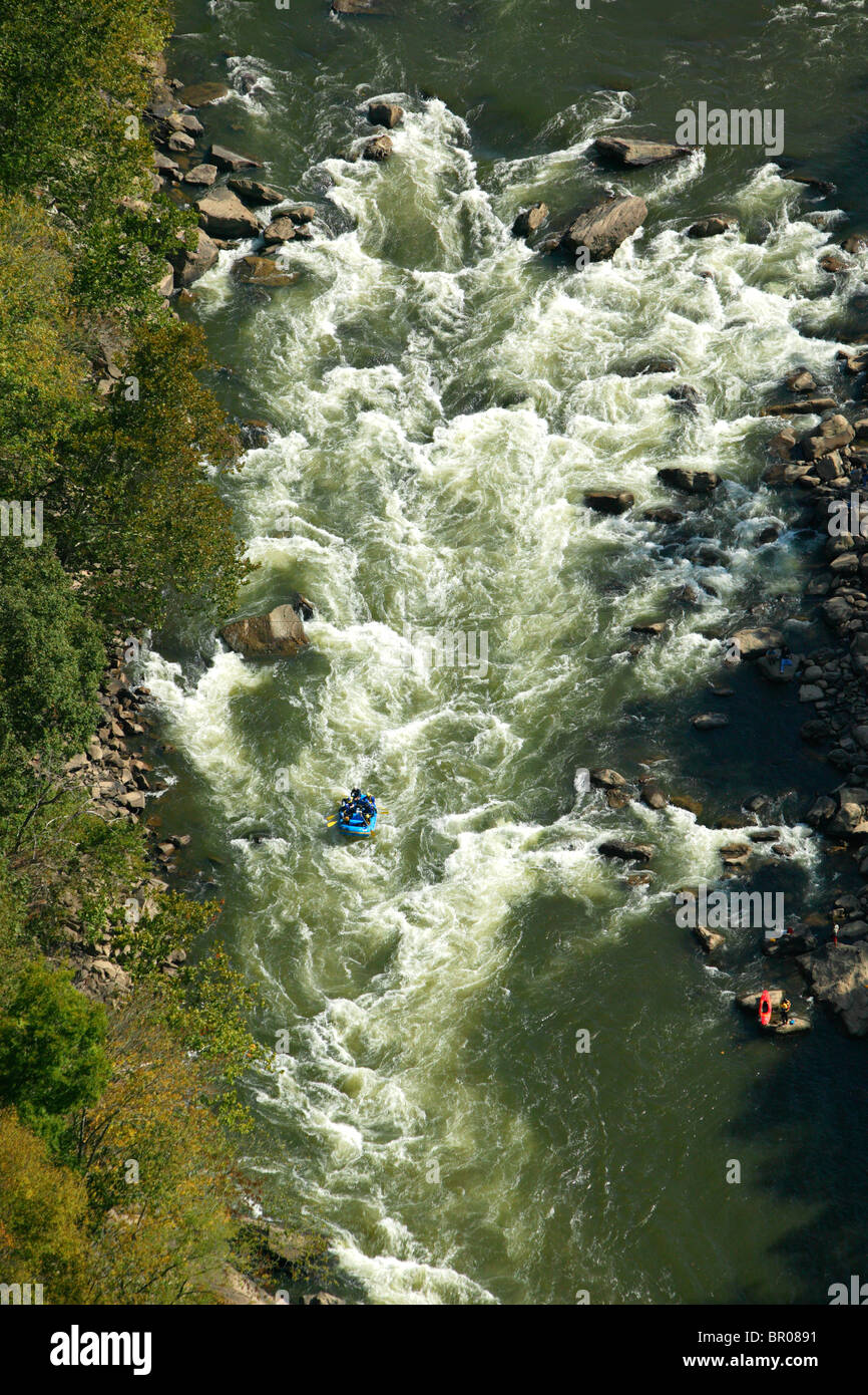 A view off a bridge looking at the rapids of a river. Stock Photo