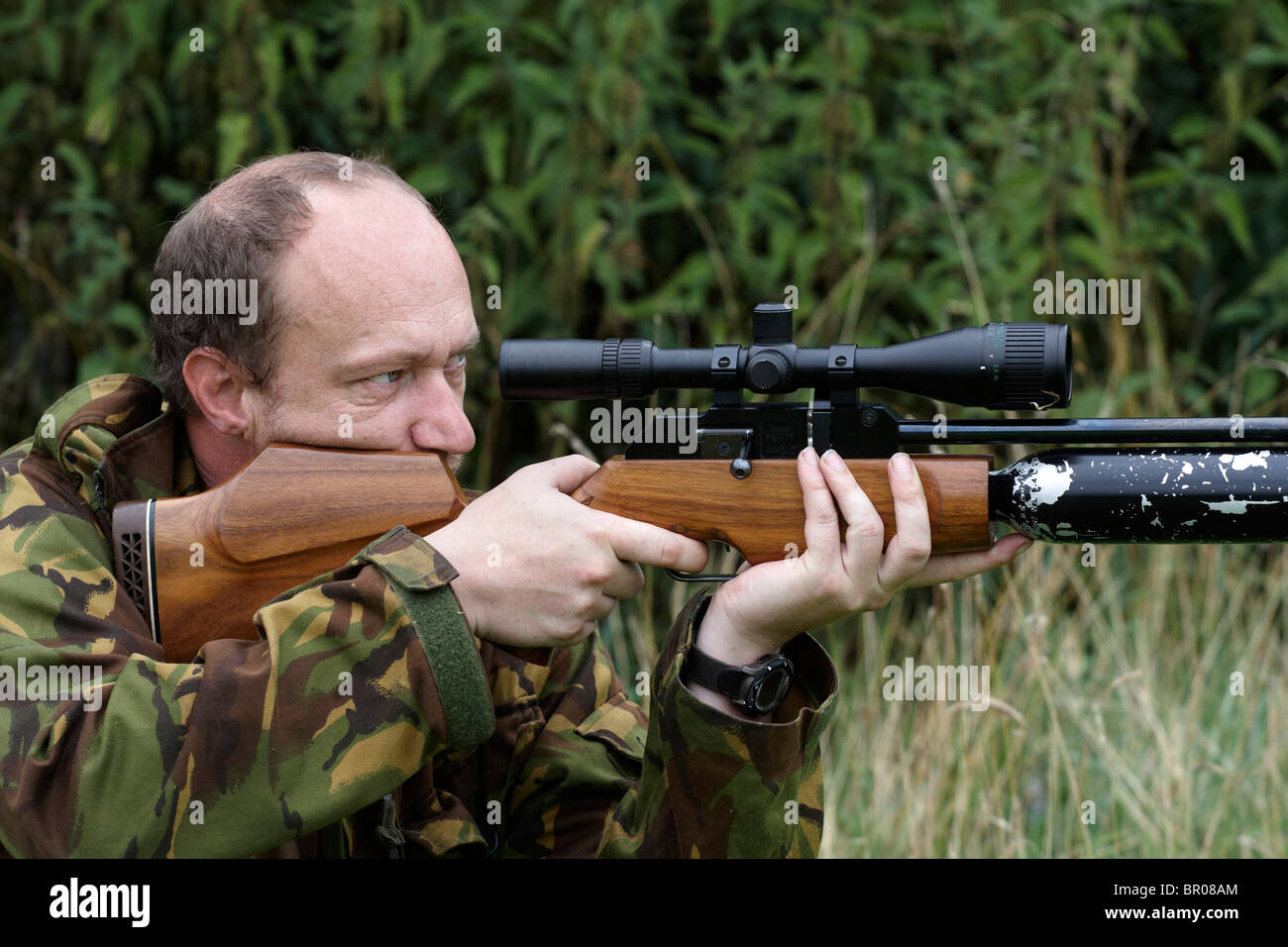 Man shooting air rifle Stock Photo