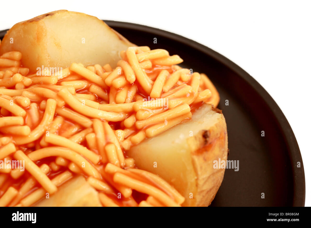 Jacket Potato with Spaghetti Stock Photo Alamy