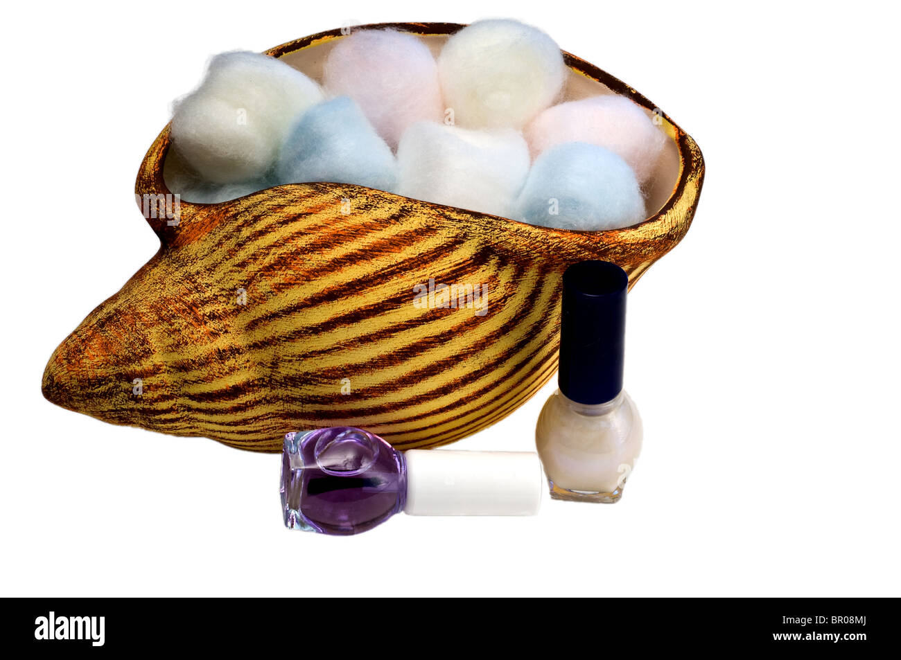Periwinkle filled with colored cotton balls and nail polish Stock Photo