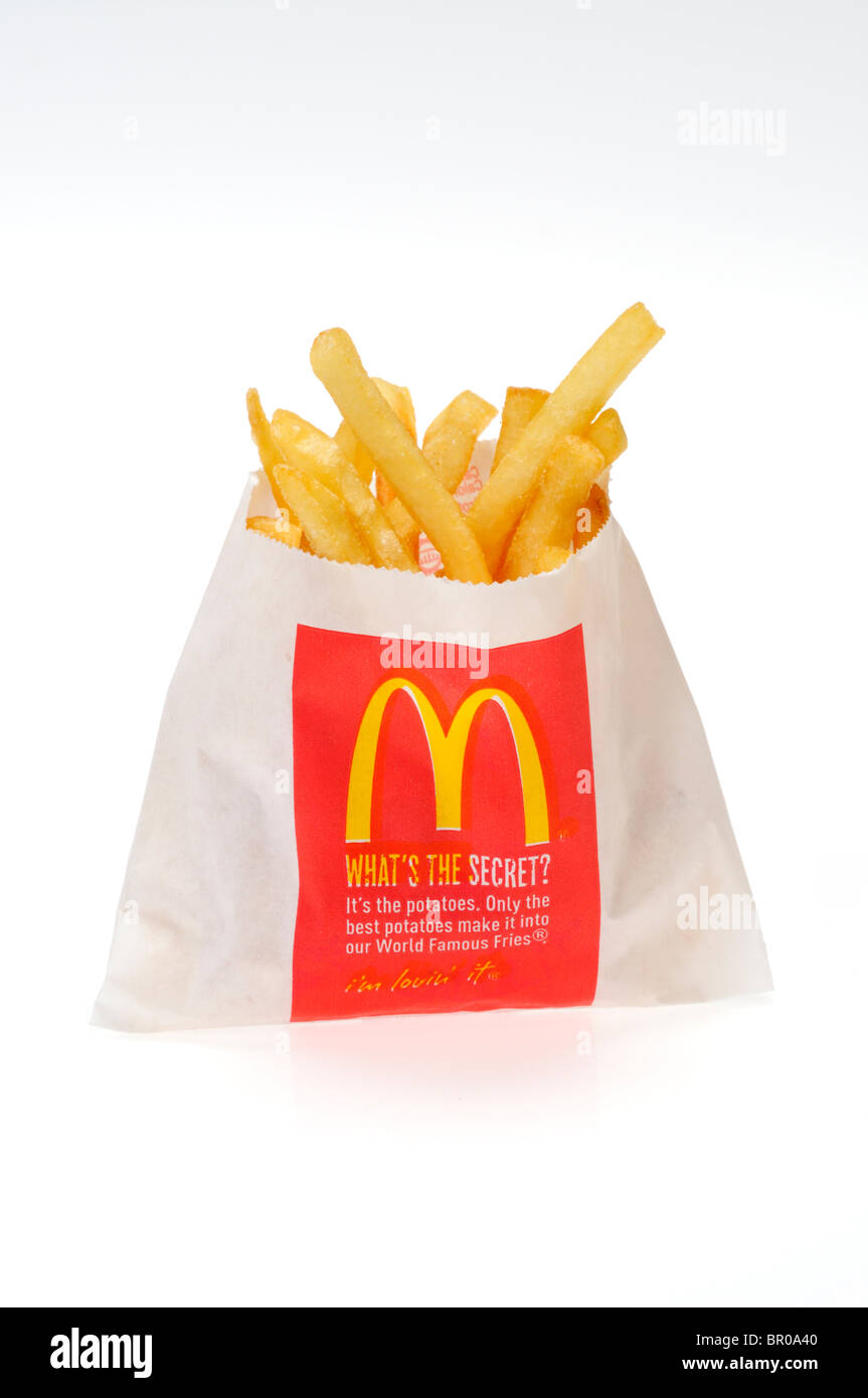 Mediabakery - Photo by Radius Images - Seasoned French Fries in Paper Bag  with Wooden Fork and Ketchup Studio Shot