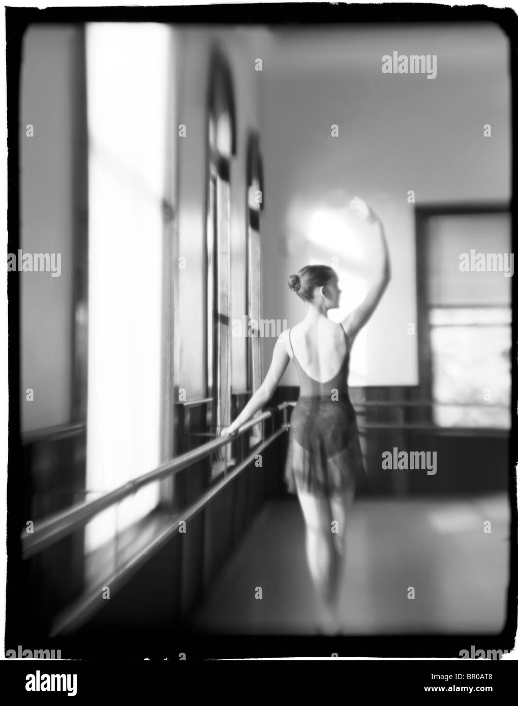 A young caucasian female ballet dancer practices a serene pose