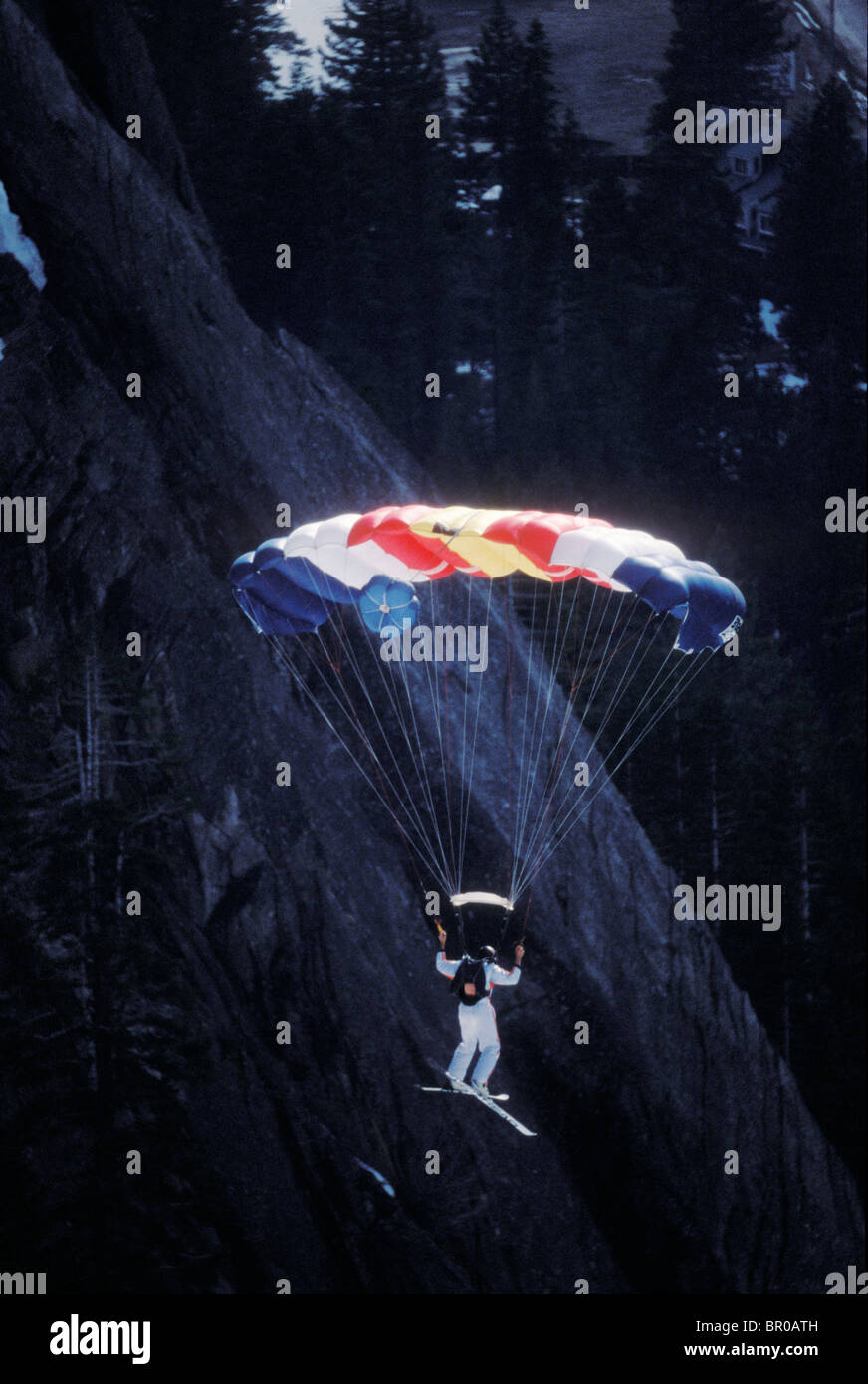 SkiBASE jumper descending via parachute, Lake Tahoe, California Stock
