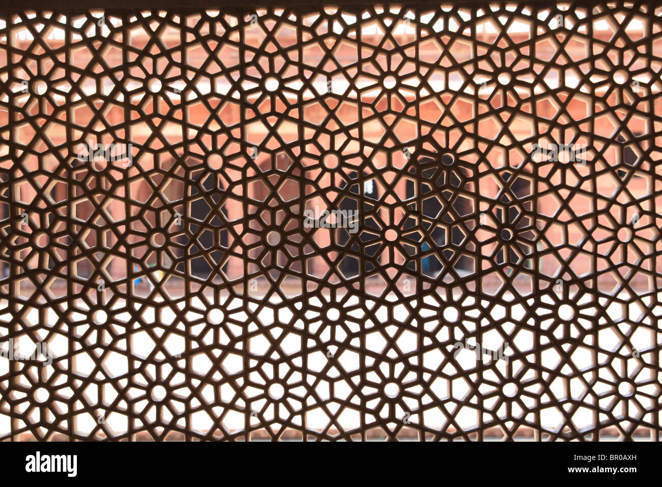 Finely carved white marble screen window of original Sufi shrine at Fatepuhr Sikri near Agra, India. Stock Photo