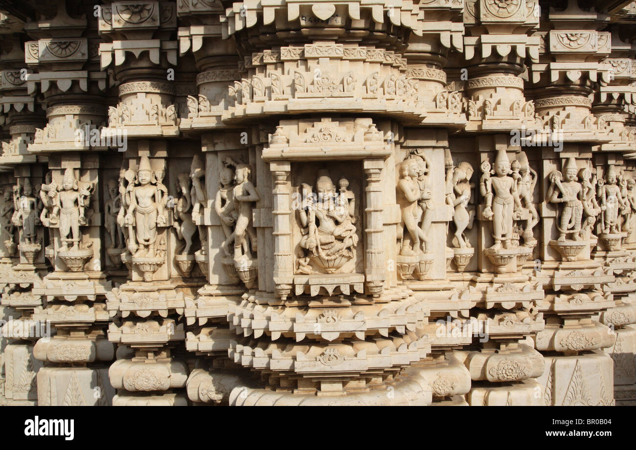 Intricately carved white stone sculptures of gods and creatures covering the Jagdish Hindu temple in Udaipur, Rajasthan. Stock Photo