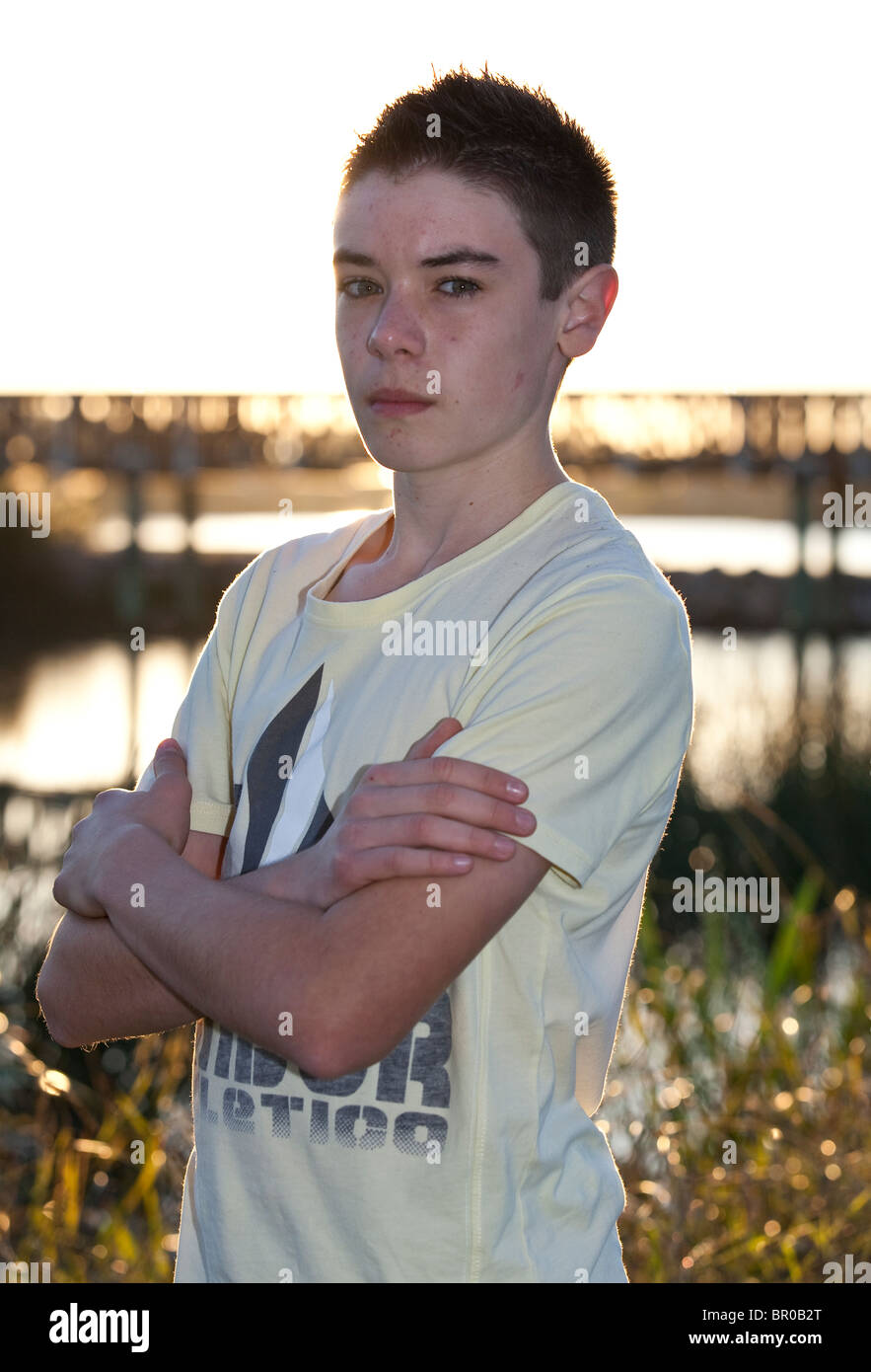 Teenage boy looking moody Stock Photo - Alamy