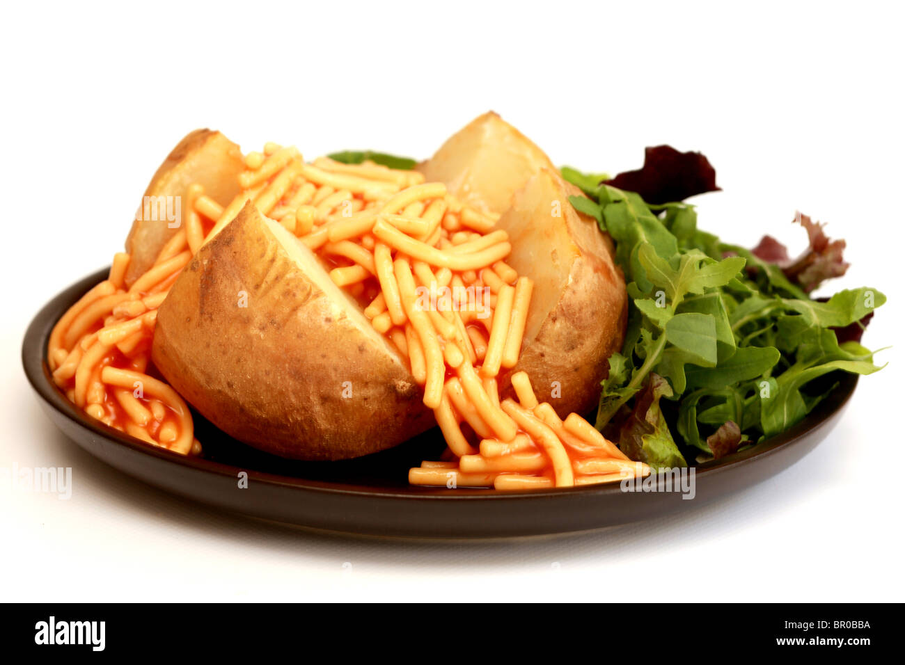 Jacket Potato with Spaghetti Stock Photo Alamy