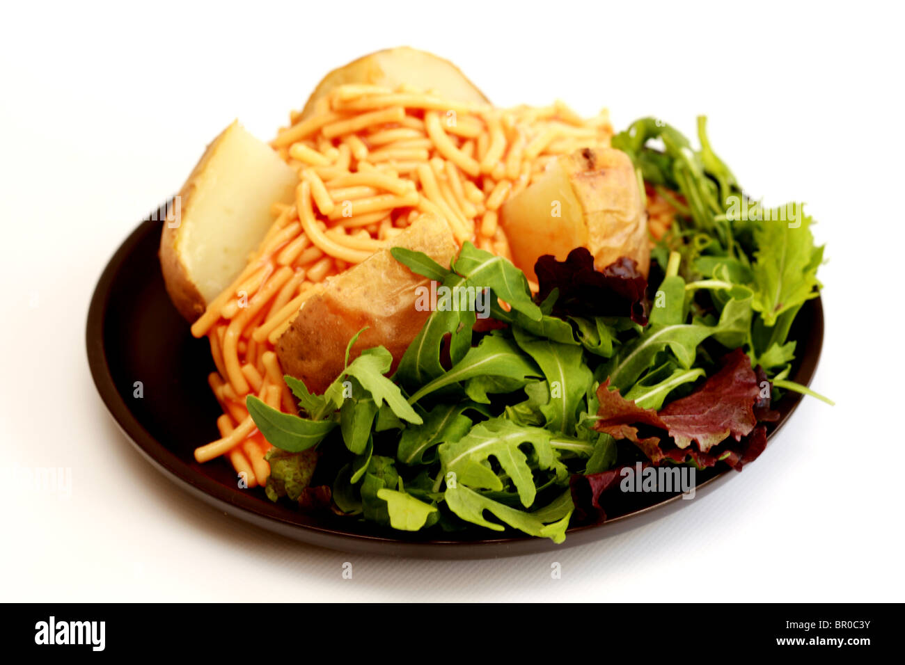 Jacket Potato with Spaghetti Stock Photo Alamy
