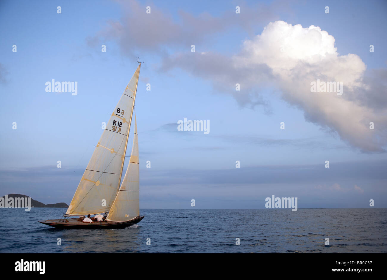 Sailing upwind at dusk. Stock Photo