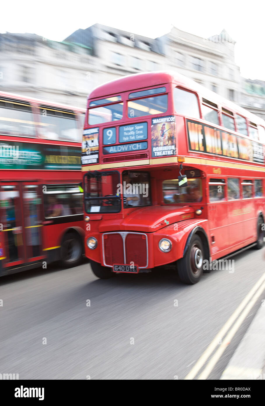 London routemaster bus at speed in Trafalgar Square Stock Photo