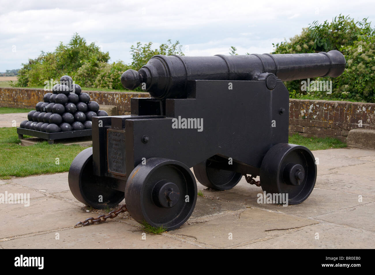 16th century cannon and monkey of cannon balls on the walls of the ancient cinque port of Rye in East Sussex, England Stock Photo